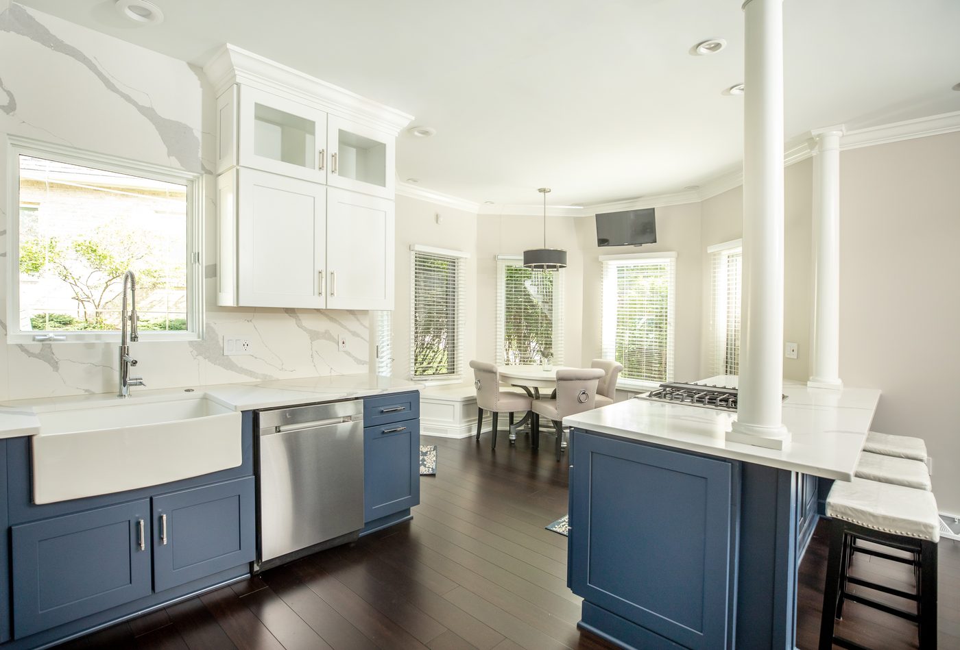Remodeled entry foyer with a glass-panel door and hardwood flooring