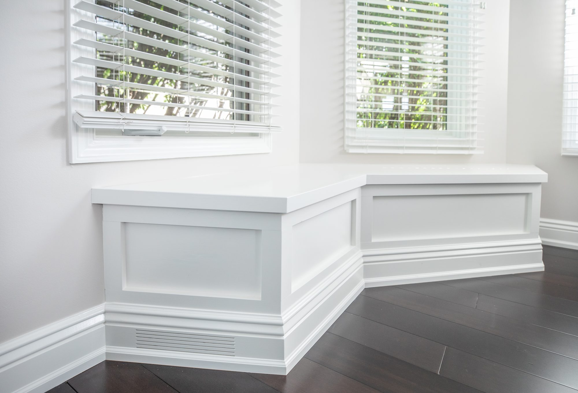 Custom built-in window-seat bench with wainscoting