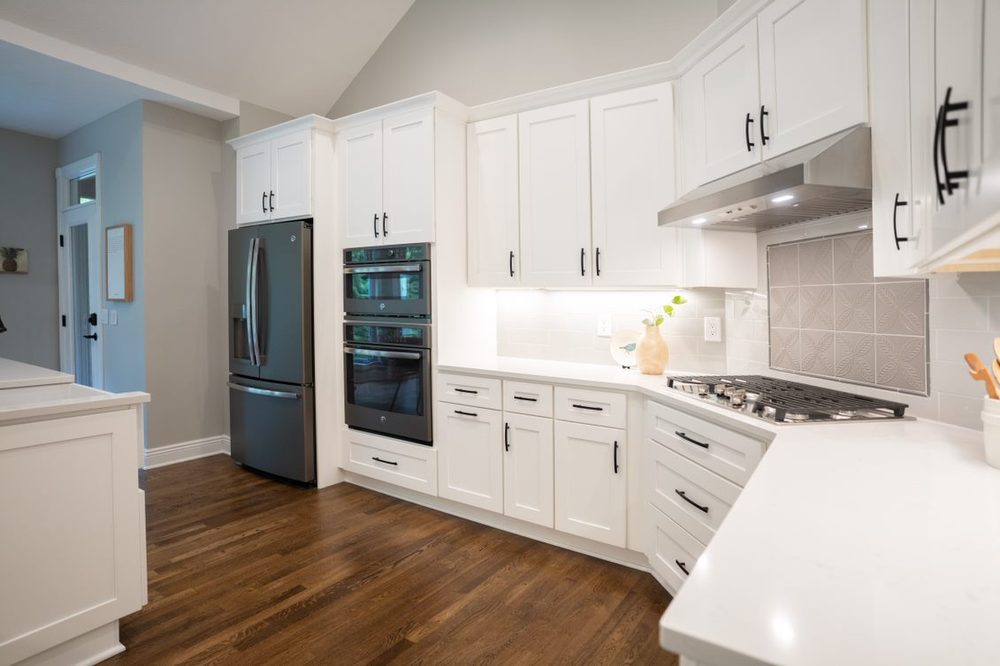 White kitchen cabinetry with black hardware