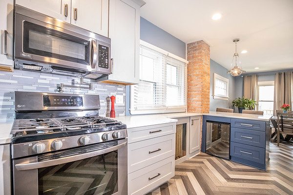 Kitchen island detail with navy cabinetry