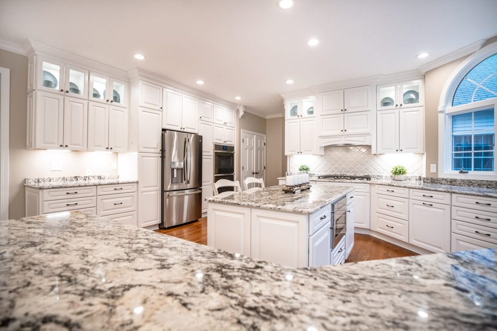 White kitchen remodel with granite countertops