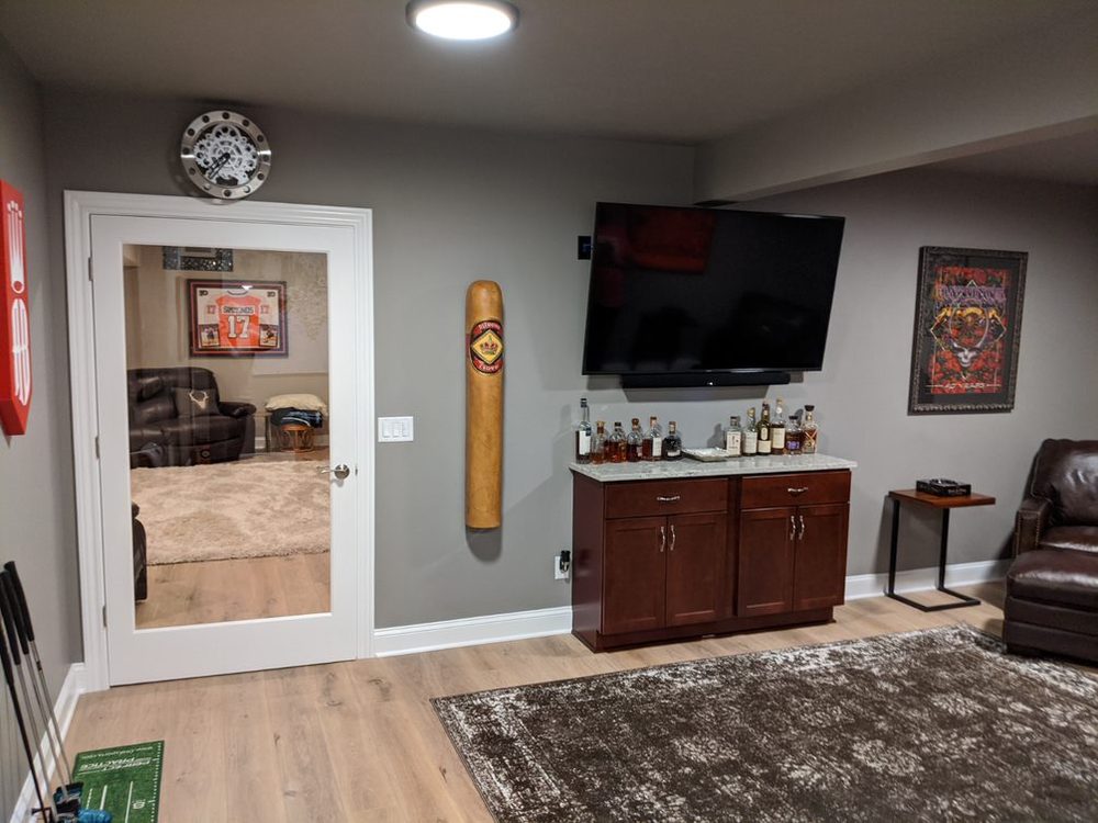 Remodeled mudroom entry with wood flooring