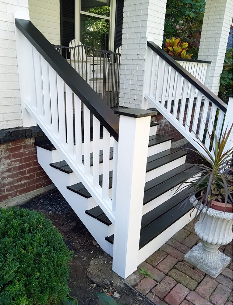 Exterior porch stairs with black-and-white railing