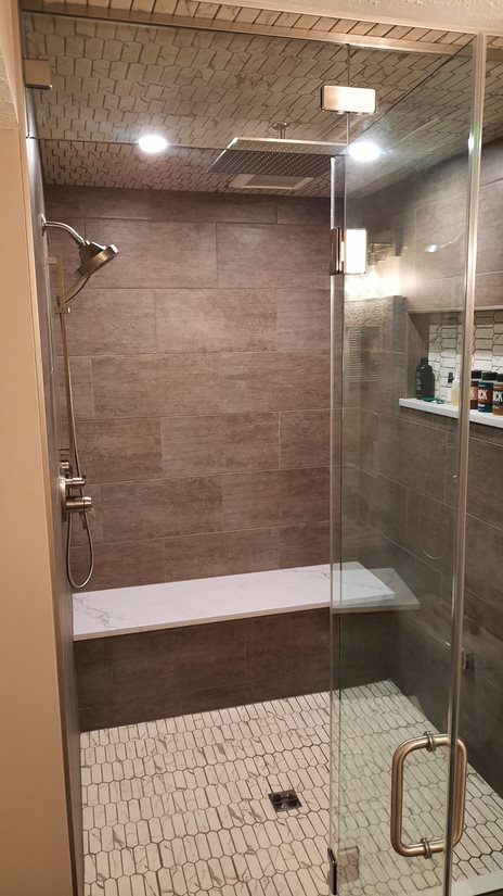 Walk-in tile shower with glass door
